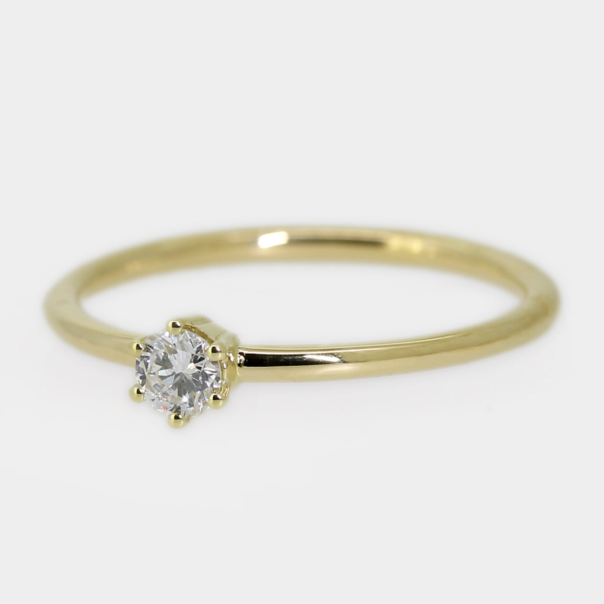 Gelbgold Brillantring mit Krappenfassung