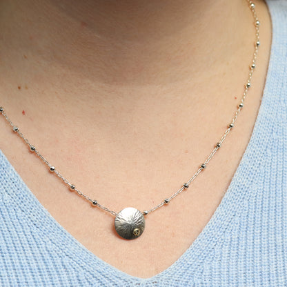 Silberscheibe mit Goldnugget