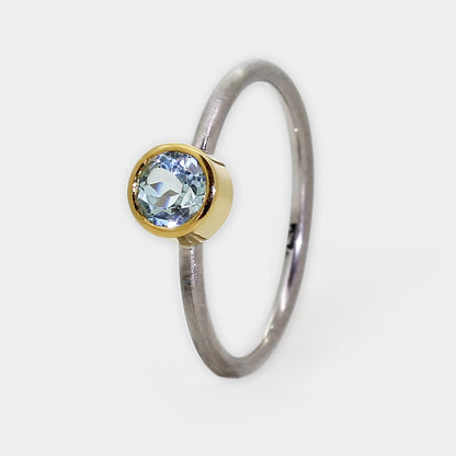 Palladium Ring mit Aquamarin in Goldfassung